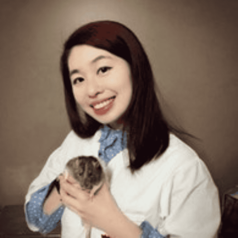 Dr. Wendy Wang veterinarian at NYP TeleVet, smiling in a white coat