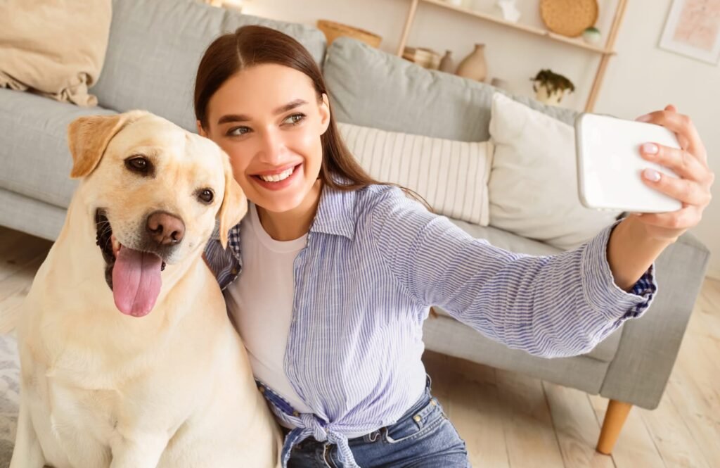 Young woman with her dog taking selfportrait – What Is a TeleVet and How Does It Work