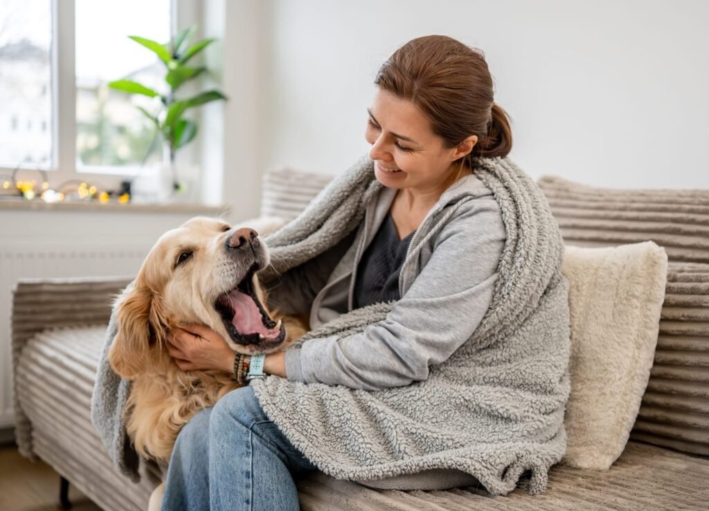Woman hugging her dog on the couch – Fireworks and Thunderstorms