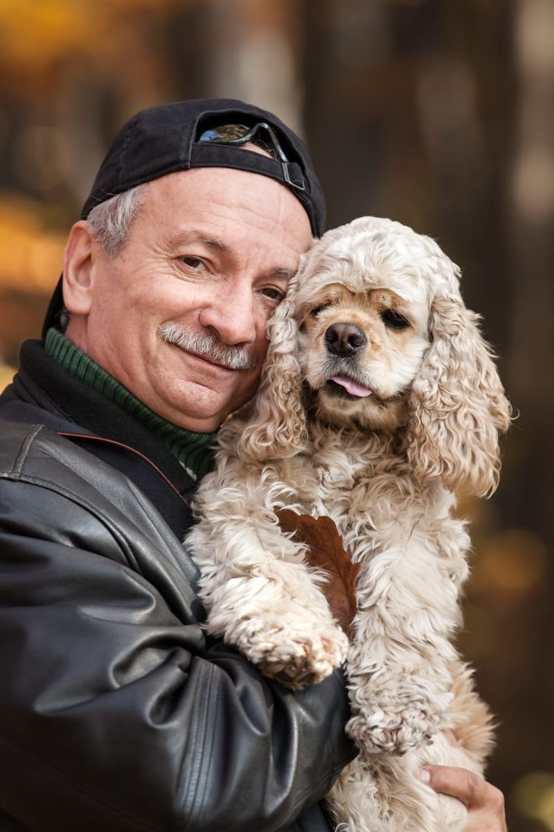 Old man with dog - Urinary Incontinence in Dogs